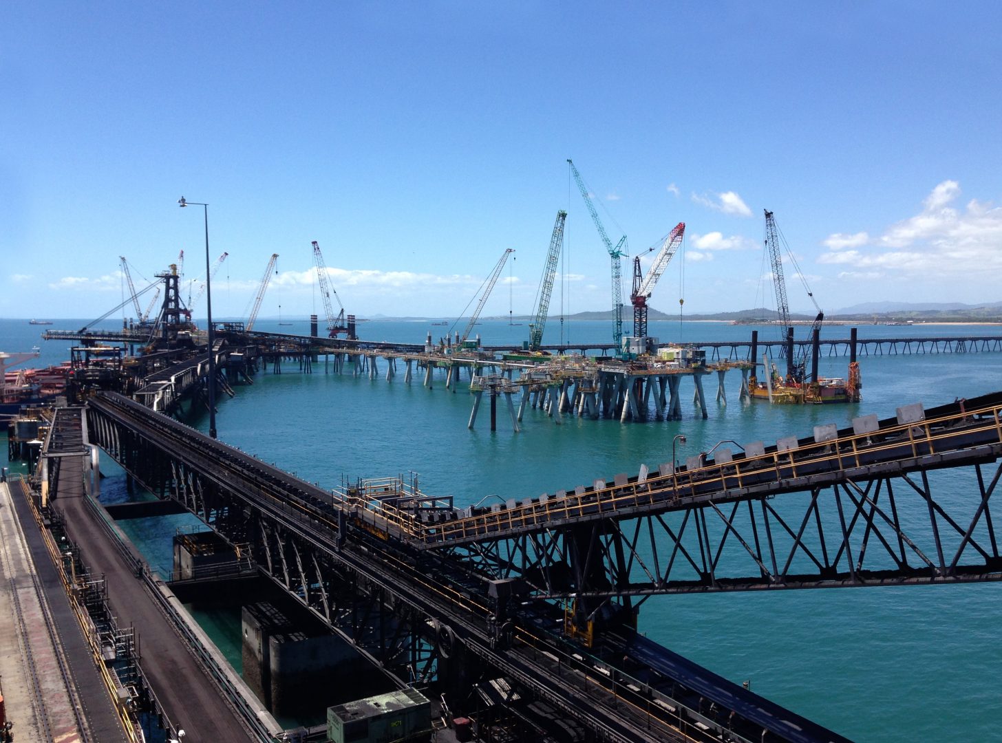 Port infrastructure construction with cranes over water